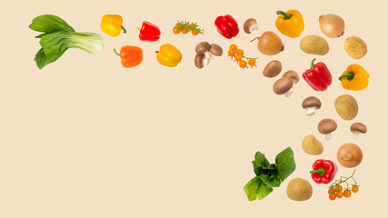 Flying vegetables light beige background,potatoes,brown mushrooms champignons,paprika,cherry tomatoe,onions,lettuce pak choi,cabbage.Vegan diet ingredients.Healthy food eating concept.Copy space
