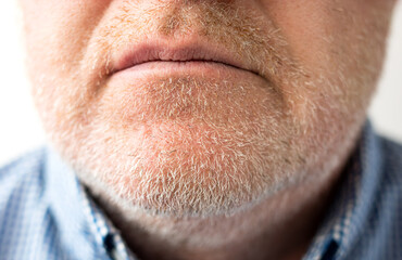 Close-up of male chin, bristle and lips