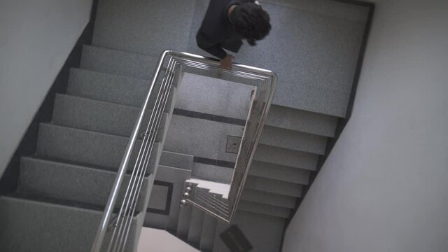 a man geting down the stairs slog 3 file in 4k quality at 25 frames per second 