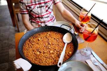 Spanish dinner. Paella and cocktails