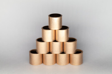 Sleeve bronze bearings pyramid, abstract installation