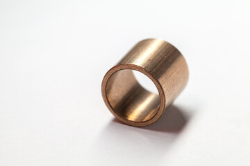Sleeve bronze bearing lays on a white background