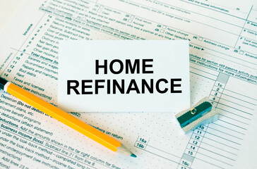 Obraz premium Business card with text Home Refinance on financial docs