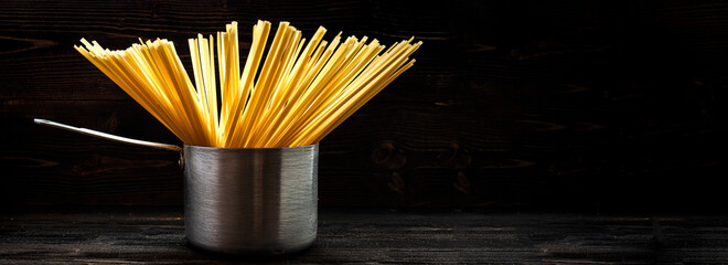 spagetti or spaghetti or noodle in brushed metal stewpot utensil