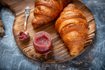 Fresh homemade croissants on textured background