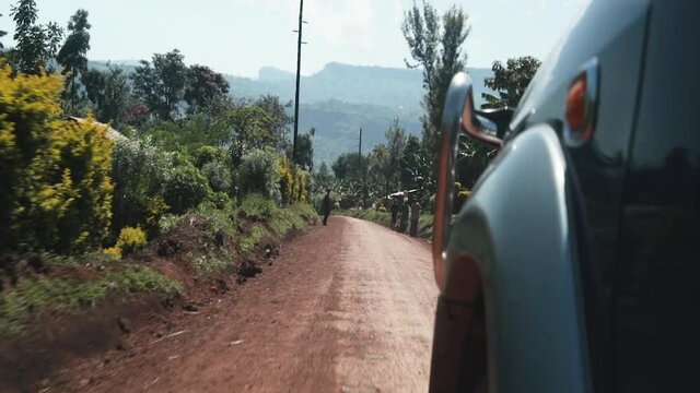 Shaky footage of a drive on a sandy road in Uganda