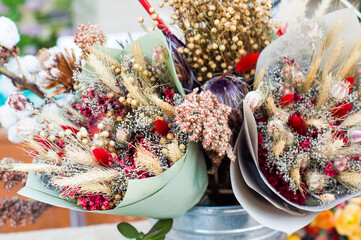 Bouquets of dried flowers in paper bundles