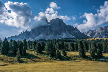 panoramic view of the Dolomites with beautiful weather clouds , Italy.