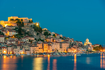 Sunset skyline of Sibenik with Saint James cathedral and fortress of Saint Michael, Croatia