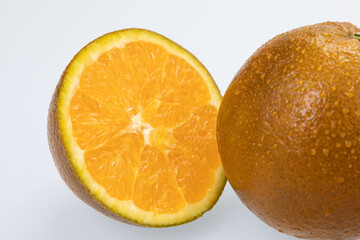 Citrus fruit (rangpur) with water drops isolated on white background
