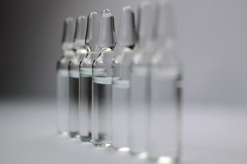 Medical ampoules for injection isolated on white background. Medicines and disease treatment,...