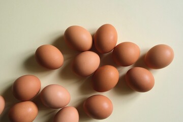 Brown eggs on a light background. View from the top.