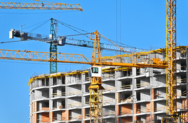 Crane and highrise construction site