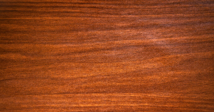 The texture is mahogany with stripes and splotches of black color