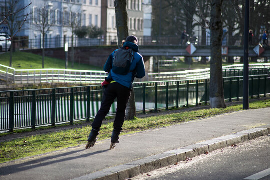 Portrait On Back View Of Man On Roller Blade In The Street