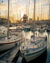 Colorful sailboats at sunset in the old harbor of La Rochelle France 