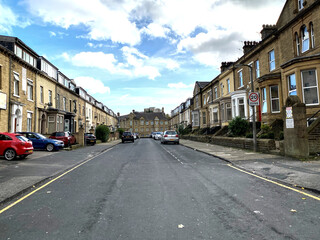 Naklejka na ściany i meble View along, Great Horton Road, with Victorian houses, on an autumn day in, Bradford, Yorkshire, UK