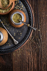 Healthy infused drink, classic Yerba Mate tea in a gourd with mobilla