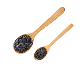 sunflowers seeds in a wooden spoon isolated on white background, top view.