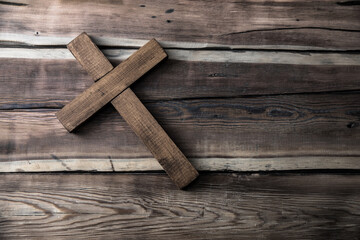 Naklejka na ściany i meble wooden cross on table