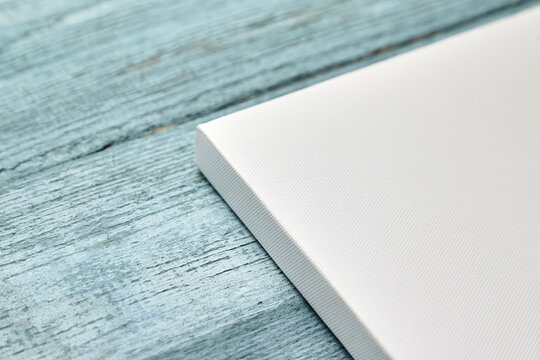 Corner of white canvas stretched on stretcher bar