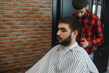 Men's haircut at the barber scissors