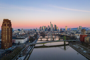 Fototapeta na wymiar Aerial panoramic picture of Frankfurt skyline with river Main with colorful sky during sunrise