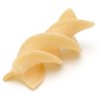 Italian  twisted pasta fusilli isolated on white background. Fusilloni, rotini.