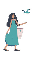 Cute girl with a beach bag and a seagull