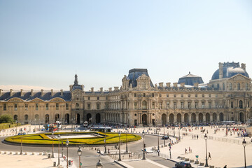 Crowds gathering in the plaza outside the Louvre in Paris
