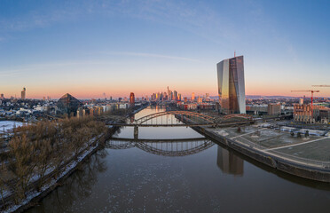 Aerial panoramic picture of Deutschherrnbrücke with Frankfurt skyline during sunrise