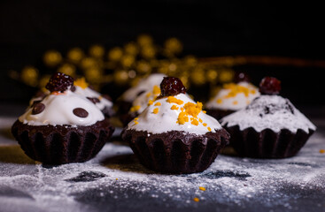 Delicious chocolate cake covered with glaze with additions of chocolate and tangerine