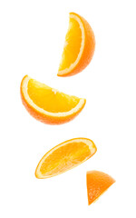 falling fresh orange fruit slices isolated on white background closeup. Flying food concept.