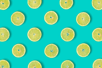 Fruit pattern of lemon slices on blue background. Flat lay, top view. .  Pop art design, creative summer concept.