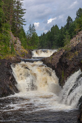 Famous Kivach Falls on the Suna River is a 10.7-m-high  cascade waterfall in the Karelia, Russia.