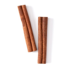 Cinnamon sticks isolated on white background closeup. Canella spice. Aromatic condiment background. Flat lay, top view.