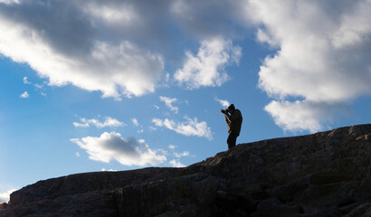 Photographer on top of a mountain 