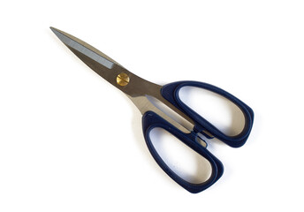 Scissors for fabric with blue handles, close-up, isolated on a white background
