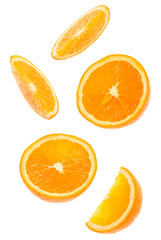 falling fresh orange fruit slices isolated on white background closeup. Flying food concept.