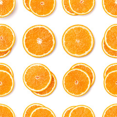 Seamless pattern of orange fruit slices. Orange slices isolated on white background. Food background. Flat lay, top view.