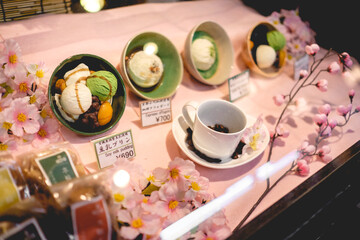 Beautiful hanami themed display with desserts and coffee at Nishiki Market in Kyoto, Japan