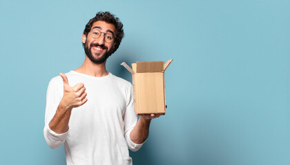 young crazy bearded man recibing a cardboard package