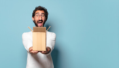 young crazy bearded man recibing a cardboard package