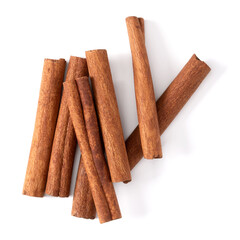 Cinnamon sticks isolated on white background closeup. Canella spice. Aromatic condiment background. Flat lay, top view.