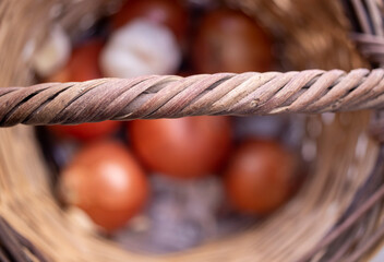 Organic onions and garlic in the wicker basket. macro, close up.