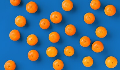 Fruit pattern of fresh orange tangerine or mandarin on blue background. Flat lay, top view. Pop art design, creative summer concept. Citrus in minimal style.