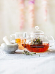 homemade herbal tea in a glass teapot