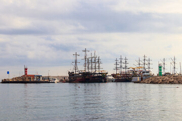 Fototapeta premium Stylized pirate yachts in marina harbor in Kemer, Turkey