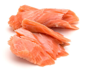 smoked salmon segments isolated on white background cutout. Prepared fish fillet fibres.
