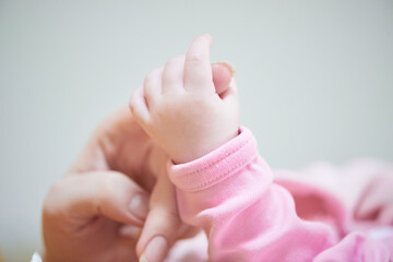 mother is playing with baby at home